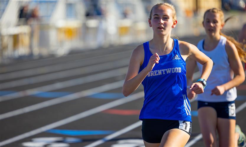 A student runs on the track